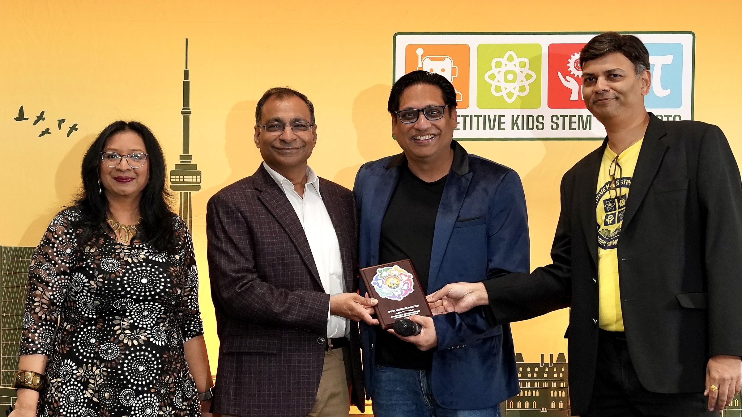 Mr. Amit Goyal receives the CKSTEM Plaque of Appreciation alongside the CKSTEM team.