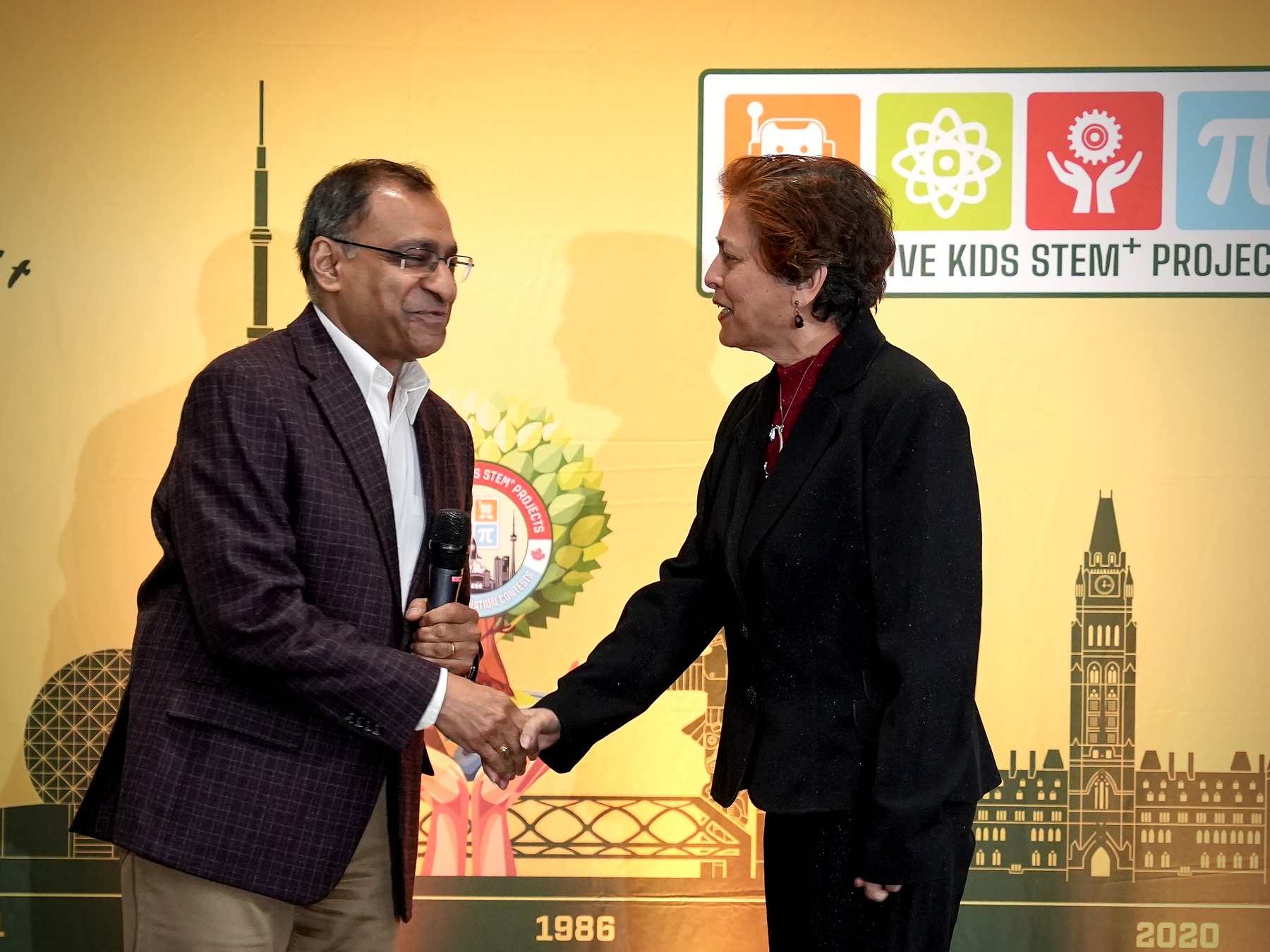 Mr. Amit Goyal congratulates Cecilia D'Mello at the 2026 Best Teacher Award presentation.