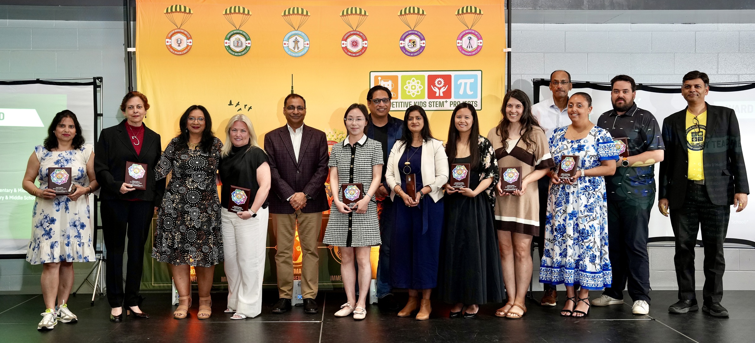 The thirteen 2026 Best Teacher Award honourees with Mr. Amit Goyal on stage at CIC 2026.